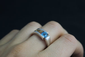 Sterling silver blue topaz tension set ring