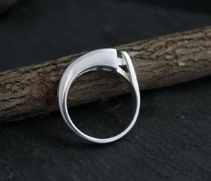 Sterling silver blue topaz tension set ring