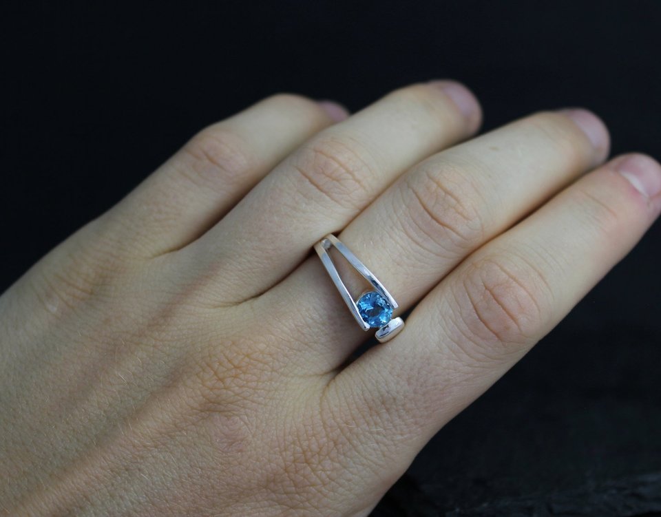 Sterling silver blue topaz tension set ring