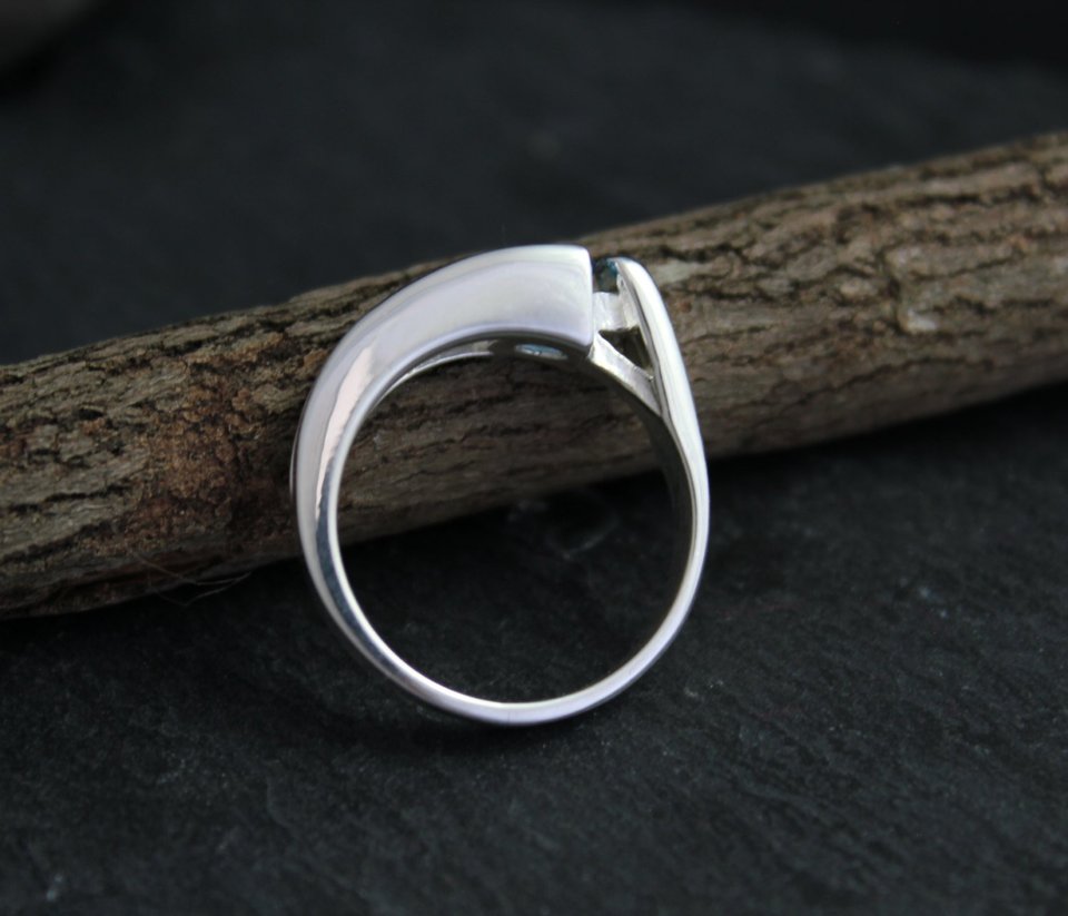 Sterling silver blue topaz tension set ring
