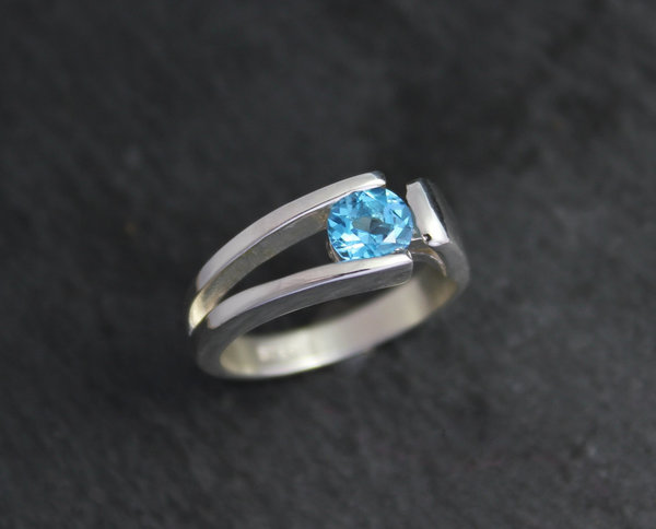 Sterling silver blue topaz tension set ring